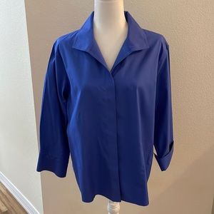 Chico’s no-iron woman’s blue dress blouse. Button front 100% cotton/pleated cuff